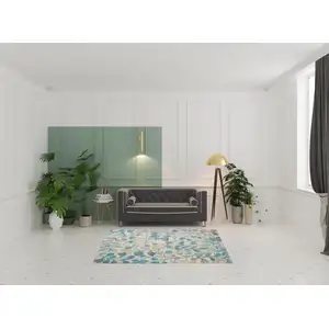 Photo of Ivory And Turquoise Botanical Leaves Area Rug