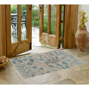 Photo of Ivory And Turquoise Botanical Leaves Area Rug