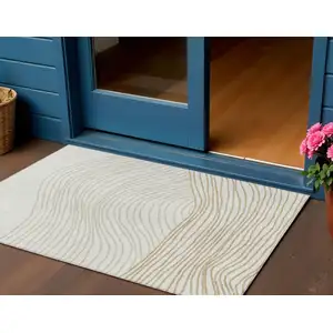 Photo of Ivory And Wheat Striped Washable Indoor Outdoor Area Rug
