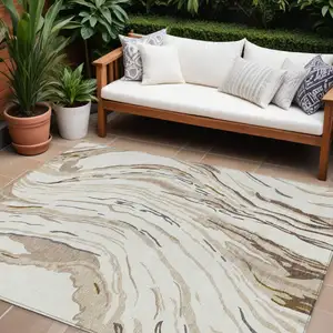 Photo of Ivory Beige And Brown Abstract Washable Indoor Outdoor Area Rug