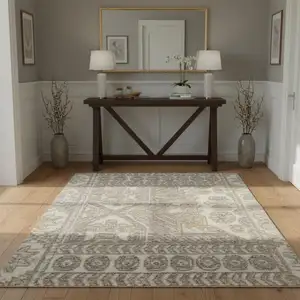 Photo of Ivory Beige And Cream Floral Area Rug With Fringe