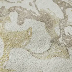 Photo of Ivory Beige And Gold Abstract Washable Area Rug With UV Protection