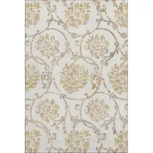 Photo of Ivory Beige And Gold Floral Washable Area Rug With UV Protection