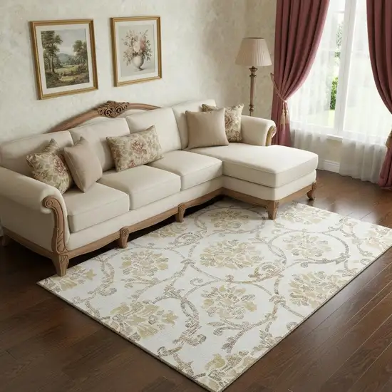 Ivory Beige And Gold Floral Washable Area Rug With UV Protection Photo 1