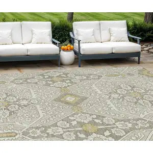 Photo of Ivory Beige And Gold Floral Washable Indoor Outdoor Area Rug