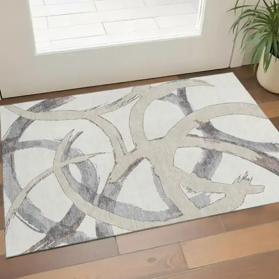 Ivory Beige And Gray Abstract Washable Area Rug With UV Protection Photo 1