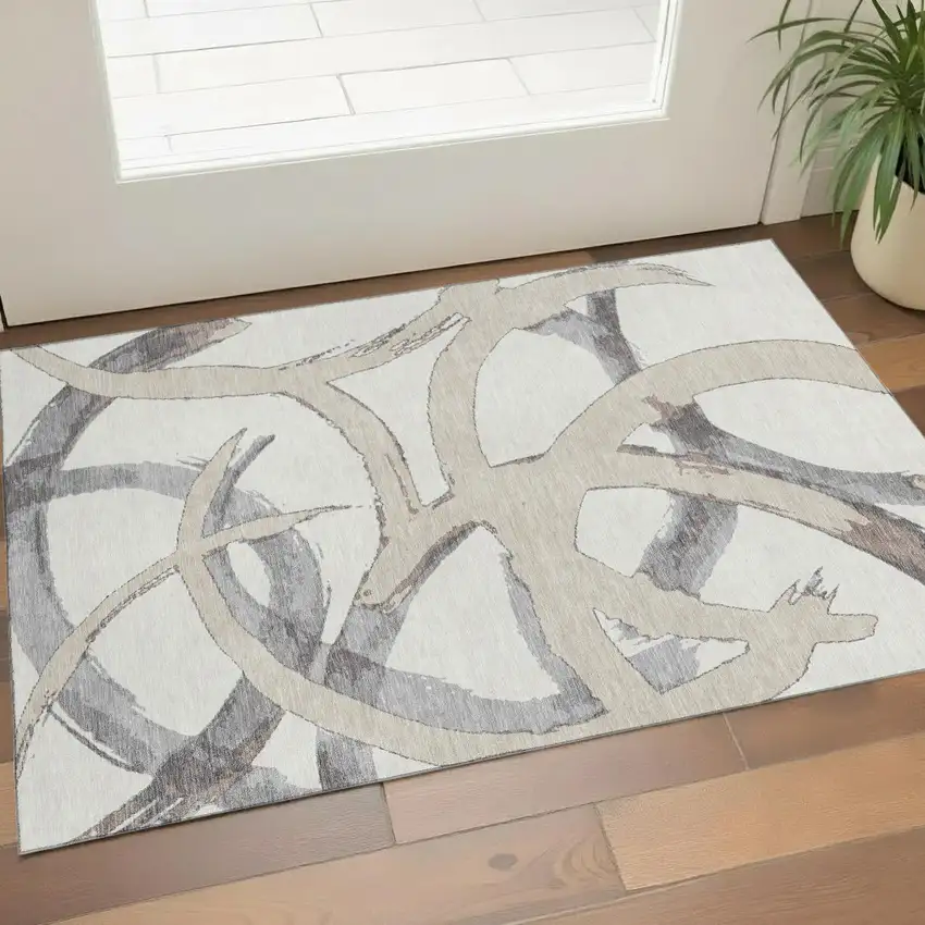 Ivory Beige And Gray Abstract Washable Area Rug With UV Protection Photo 1