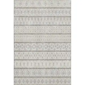 Photo of Ivory Beige And Gray Ikat Washable Area Rug With UV Protection