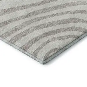 Photo of Ivory Beige And Khaki Abstract Washable Area Rug With UV Protection