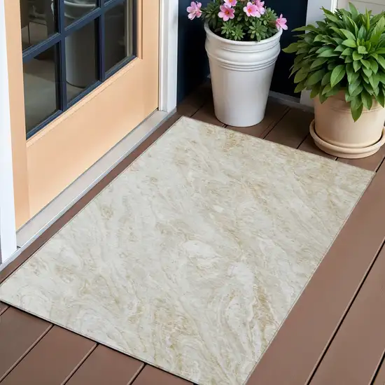 Ivory Beige And Tan Abstract Washable Indoor Outdoor Area Rug Photo 1