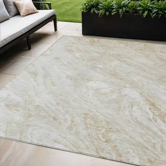 Ivory Beige And Tan Abstract Washable Indoor Outdoor Area Rug Photo 1