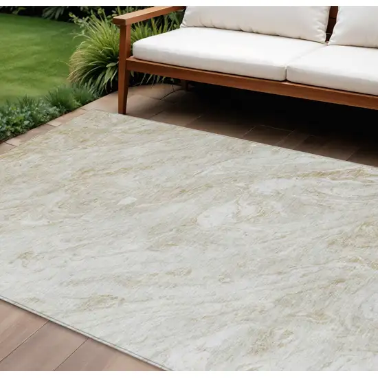 Ivory Beige And Tan Abstract Washable Indoor Outdoor Area Rug Photo 1