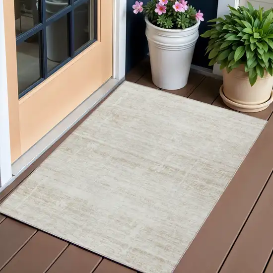 Ivory Beige And Tan Abstract Washable Indoor Outdoor Area Rug Photo 1