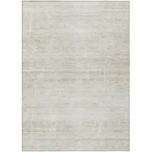 Photo of Ivory Beige And Tan Abstract Washable Indoor Outdoor Area Rug