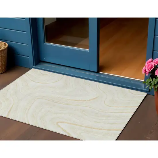 Ivory Beige And Tan Abstract Washable Indoor Outdoor Area Rug Photo 1