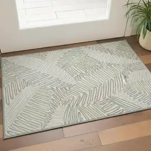 Photo of Ivory Beige And Tan Floral Washable Area Rug With UV Protection