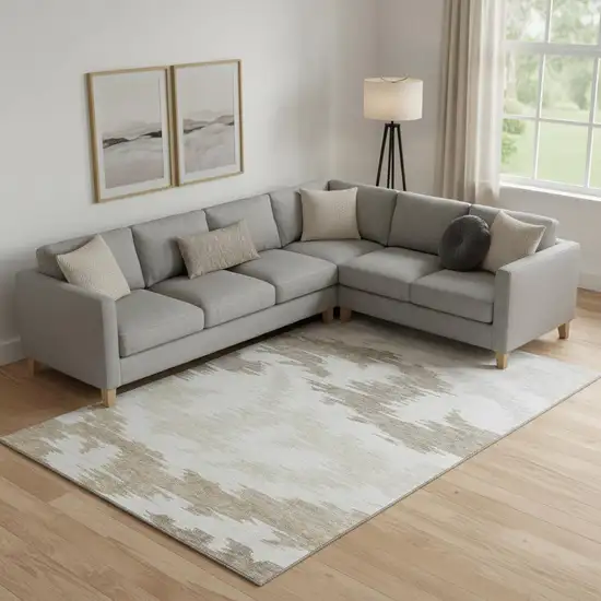 Ivory Beige And Taupe Abstract Washable Area Rug With UV Protection Photo 1