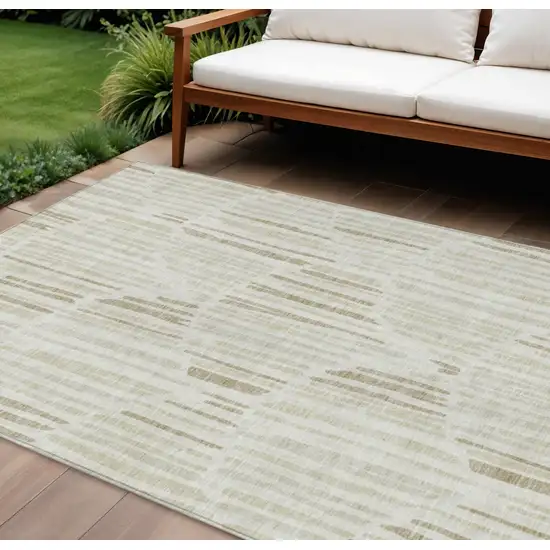 Ivory Beige And Taupe Abstract Washable Indoor Outdoor Area Rug Photo 1