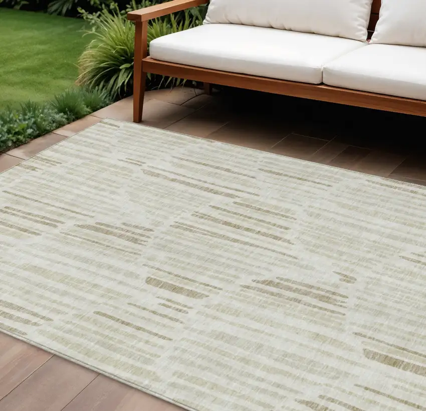 Ivory Beige And Taupe Abstract Washable Indoor Outdoor Area Rug Photo 1