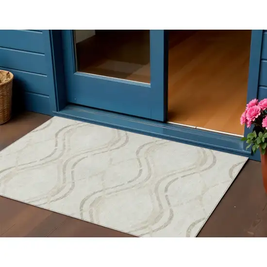 Ivory Beige And Taupe Abstract Washable Indoor Outdoor Area Rug Photo 1