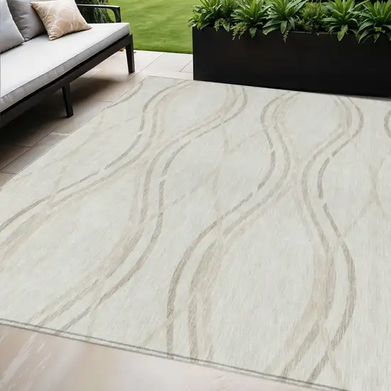 Ivory Beige And Taupe Abstract Washable Indoor Outdoor Area Rug Photo 1