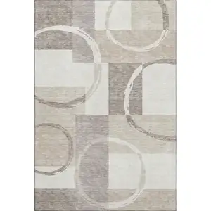 Photo of Ivory Beige And Taupe Geometric Washable Area Rug With UV Protection