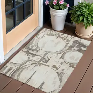Photo of Ivory Beige And Taupe Geometric Washable Indoor Outdoor Area Rug