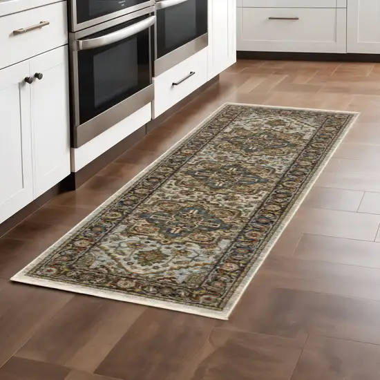 2' X 8' Ivory Beige Blue Orange Gold Green Grey And Rust Oriental Power Loom Stain Resistant Runner Rug With Fringe Photo 1