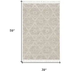 Photo of Ivory Beige Diamonds Area Rug with Fringe