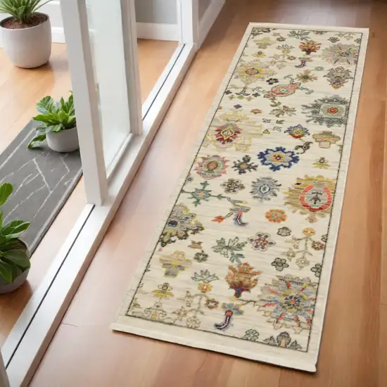 2' X 6' Ivory Beige Gold Grey Blue Pink Red Rust And Green Oriental Power Loom Stain Resistant Runner Rug With Fringe Photo 1