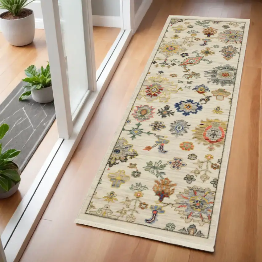 2' X 6' Ivory Beige Gold Grey Blue Pink Red Rust And Green Oriental Power Loom Stain Resistant Runner Rug With Fringe Photo 1