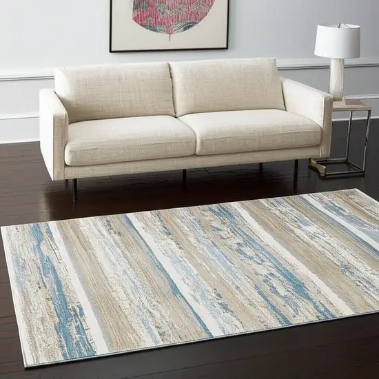 Ivory Beige Grey Blue And Tan Abstract Power Loom Stain Resistant Area Rug With Fringe Photo 2