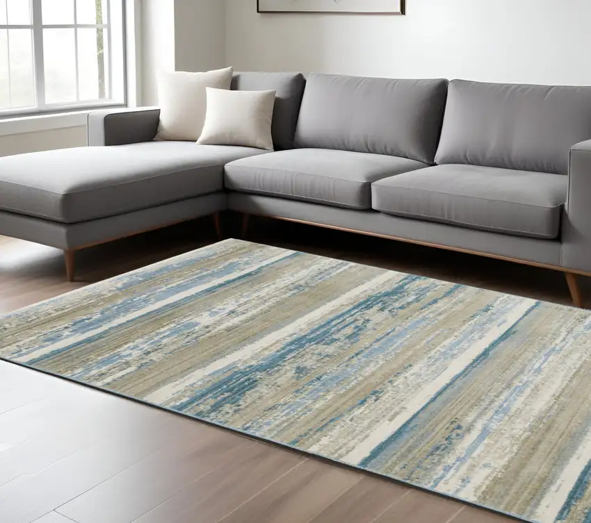 Ivory Beige Grey Blue And Tan Abstract Power Loom Stain Resistant Area Rug With Fringe Photo 1