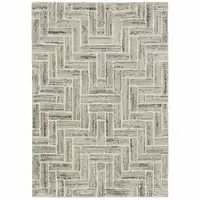 Photo of Ivory Beige Grey Brown Pale Blue And Charcoal Geometric Power Loom Stain Resistant Area Rug