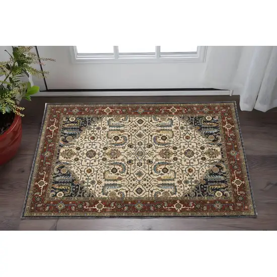 Ivory Beige Red Blue Gold Green And Navy Oriental Power Loom Stain Resistant Area Rug With Fringe Photo 1