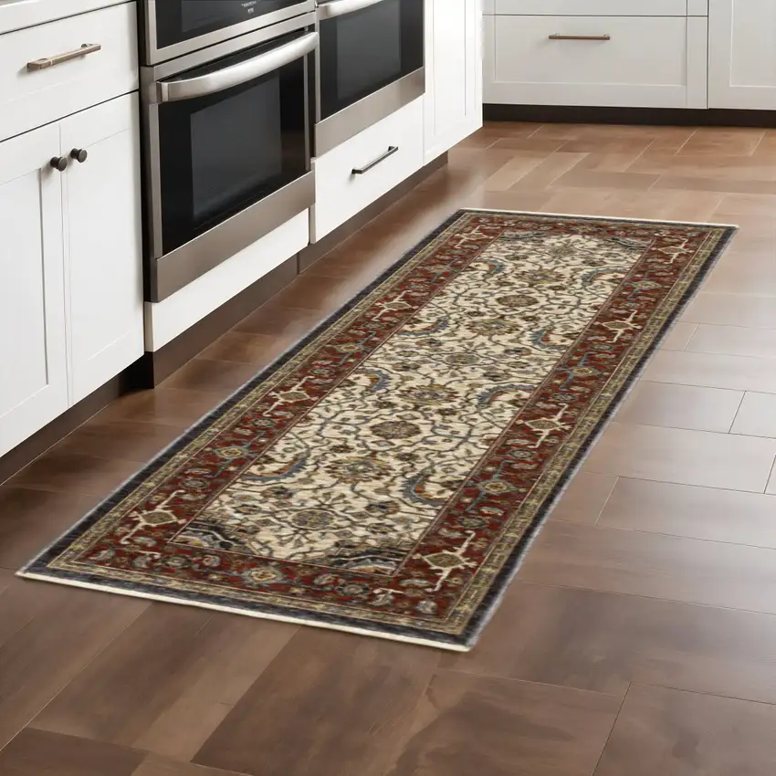 2' X 8' Ivory Beige Red Blue Gold Green And Navy Oriental Power Loom Stain Resistant Runner Rug With Fringe Photo 1