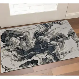Photo of Ivory Black And Taupe Abstract Area Rug
