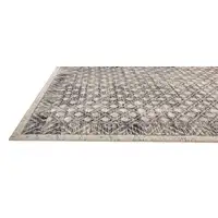 Photo of Ivory Black And Taupe Abstract Stain Resistant Area Rug