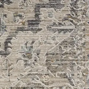 Photo of Ivory Black And Taupe Medallion Distressed Area Rug With Fringe