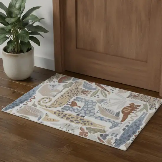 Ivory Blue And Beige Animal Print Area Rug Photo 1