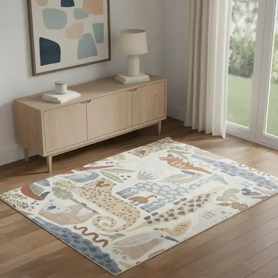 Ivory Blue And Beige Animal Print Area Rug Photo 1