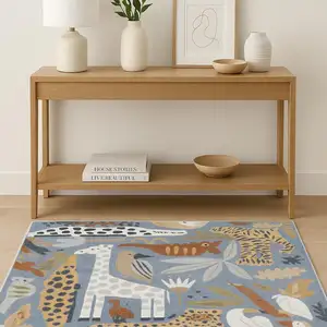 Photo of Ivory Blue And Beige Animal Print Area Rug