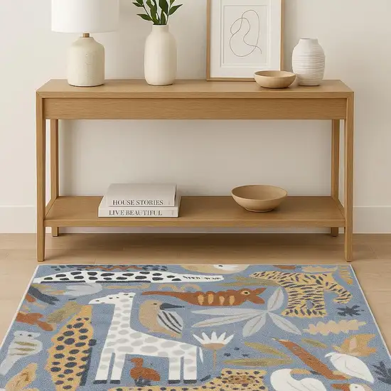 Ivory Blue And Beige Animal Print Area Rug Photo 1