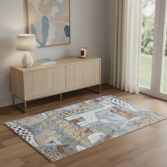 Ivory Blue And Beige Animal Print Area Rug Photo 1