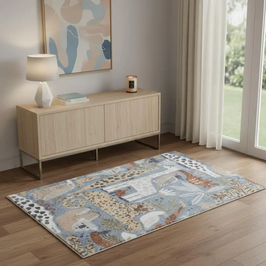 Ivory Blue And Beige Animal Print Area Rug Photo 1