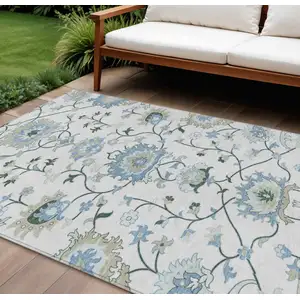 Photo of Ivory Blue And Beige Floral Washable Indoor Outdoor Area Rug