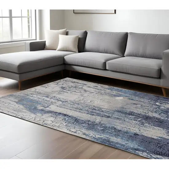 Ivory Blue And Black Abstract Power Loom Distressed Area Rug Photo 1