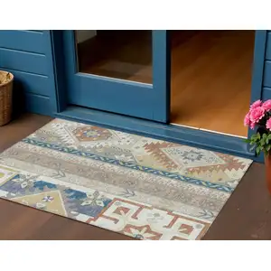 Photo of Ivory Blue And Brown Aztec Washable Indoor Outdoor Area Rug