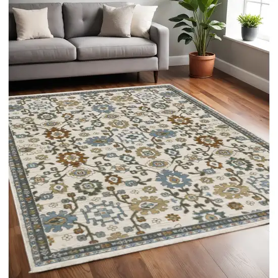 Ivory Blue And Brown Floral Area Rug With Fringe Photo 1