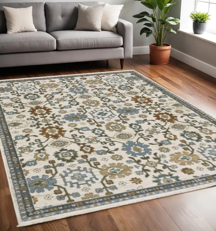 Ivory Blue And Brown Floral Area Rug With Fringe Photo 1